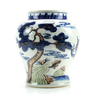 A Chinese Molded Underglaze - Blue,  Copper - Red And Celadon - Decorated Jar