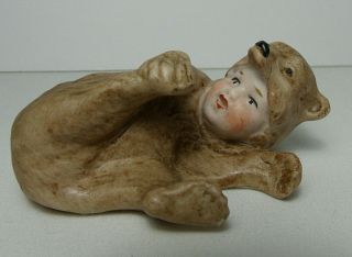Antique German Porcelain Bisque Baby In Bear Suit Figurine Whimsy Miniature 2.  5 "