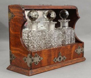 Small Antique Arts & Crafts Oak Tantalus Cut & Polished Glass Decanter Bottles