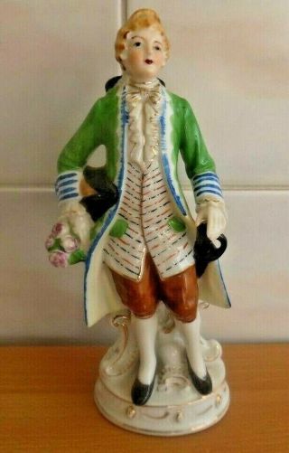 Porcelain Man In 18th Century Dress With Flowers.  20cms