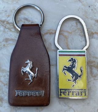Two Vintage Ferrari Keychains - Leather And A.  E.  Lorioli Enamel
