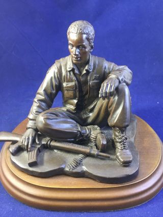 Resin - Brave United States Soldier Sitting With Rifle Sculpture - On Wood Base