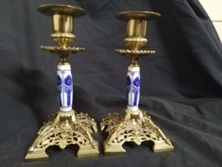 A Vintage Brass And Enamel Blue Candlesticks