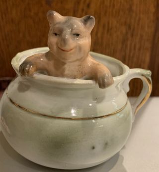 Antique German Pink Pig Porcelain Fairing Teddy Bear In A Cup Or Pot Figurine
