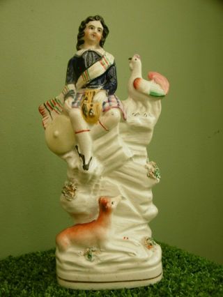 Mid 19thc Staffordshire Seated Scots Figure With Dog & Chicken