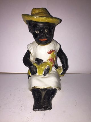 Black Americana Bisque Figure Of A Man Sitting Holding A Bottle And Chicken. 3