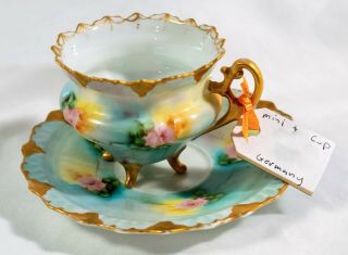 Antique Porcelain 4 Footed Demitasse Cup And Saucer With Gold Trim And Handle