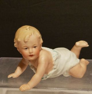 Vintage Bisque Porcelain Crawling Piano Baby.  Marked Dep.  Nr