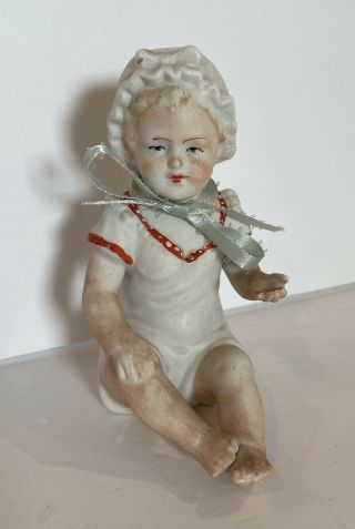 Antique German Porcelain Sitting Piano Baby Bisque Figurine Doll