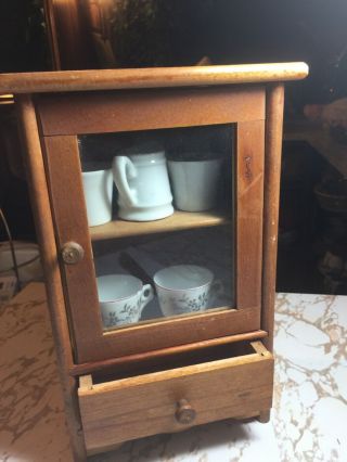 Doll Furniture,  Wood Cabinet With 2 Cups.  One Cup /w Chip,  And Creamer.  10”x6”.
