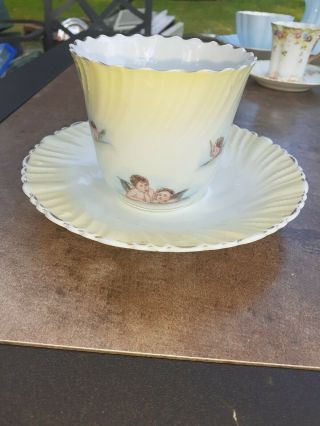 Vintage Porcelain Tea Cup And Saucer With Cherubs.  Unbranded No Markings