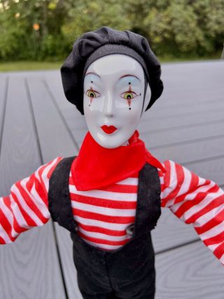 French Mime Doll Holding Theatrical Masks Of Tragedy And Comedy