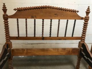 Two twin Jenny Lind Spindle Spool Bed Frames in medium wood color 2