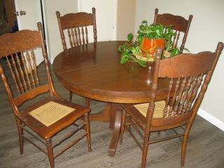 4 - Antique Pressed High Back Dinning Chairs With Cane Seats And Hardwood Table