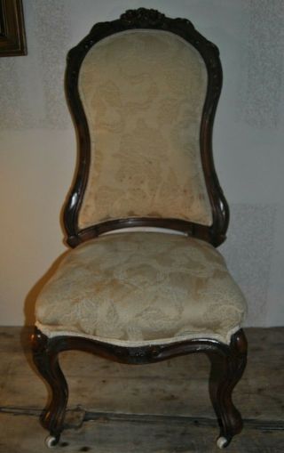 Antique Parlor Chair On Wheels 43 1/2 " Tall Width Of Seat 18 1/2 " By 18 1/2 "
