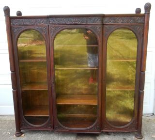 Antique American Intricately Carved Anthacus Three Door Bookcase 64 Inches