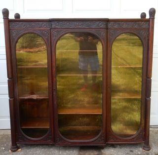 Antique American Intricately carved anthacus three door Bookcase 64 inches 3
