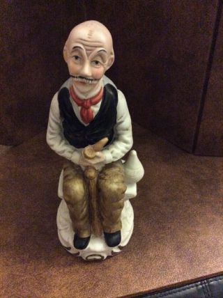 Flambro Fine Porcelain Old Man Sitting On A Bench Holding A Pipe