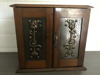 Oak Arts And Crafts Smokers Cabinet With Double Door And Embossed Copper Panels