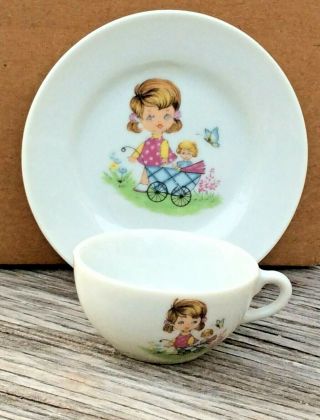 Vintage Miniature Tea Cup/saucer Child W/doll In Doll Carriage Made In Japan