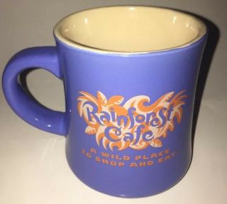Rain Forest Café Coffee Mug Blue Purple Tint Orange “ Wild Place To Shop And Eat