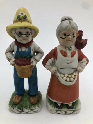 Vintage Old Man & Woman Porcelain Figurines 7” Carrying Apples & Eggs