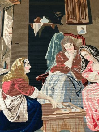 A large antique 19th century woolwork tapestry of three ladies playing cards 2