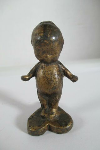 Antique Cast Iron Gold Painted Kewpie Doll Standing On A Heart Paperweight