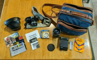 Vintage 1979 Nikon Em With 50mm Lens,  Promaster Lens,  Camera Bag,  & Manuals