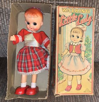 Vintage Japan Wind Up Doll Walking Little Lady Tin Toy Good