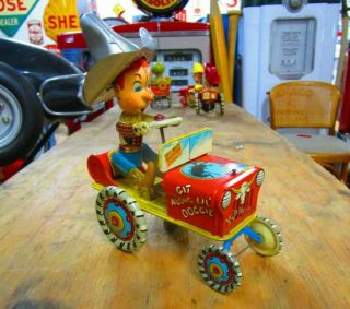 Vintage 1950s Unique Art Rodeo Joe Tin Wind Up Tractor Toy