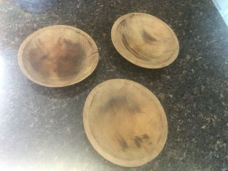 Three Small Primitive Antique Wooden Bowls With Raised Rim.