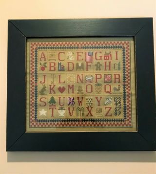 Primitive Cross Stitch Alphabet Sampler