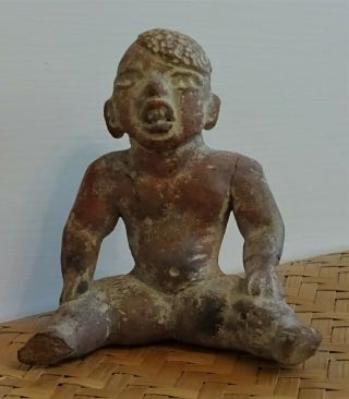 Pre - Columbian,  Seated Man With Growth On Head,  Almost 4 " High,  Red,  Black Color.