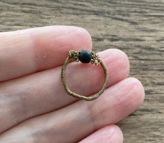 Tudor Period.  16th Century.  Brass Coiled Finger Ring With Central Bead.