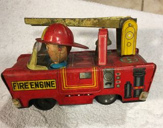 Very Rare Tin Fireman In Fire Engine With Ladder& Bell Trade Mark Ai - Japan