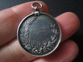 A very rare equestrian sport silver fob medal,  1920.  The HOLMES coat of arms. 2