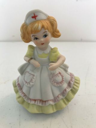 Vintage Ucagco Porcelain Nurse Figurine Girl Yellow Dress