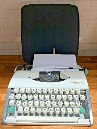 Vintage Olympia Sf Deluxe Ultra Portable Typewriter,  Pebbled Leather Case Zip