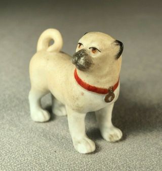 ANTIQUE BISQUE PORCELAIN PUG DOG FIGURINE,  MINIATURE,  WEARING RED COLLAR W/ TAG 2