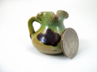Miniature Red Clay Pottery Mottled Green And Brown Pitcher 1.  5 "