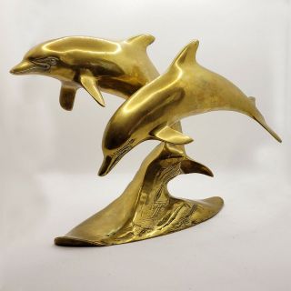 Mid Century Large Brass Nautical Dolphins Swimming Together Sculpture