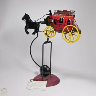 Vintage Handcrafted & Painted Metal Wells Fargo Stagecoach Balance Toy.  It Moves
