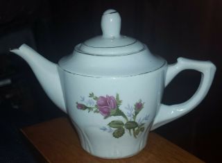 Vintage White Ceramic Tea Pot With Flower And Light Green Leaves