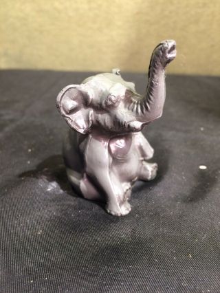 The Crane & Breed Mfg.  Co.  Metal Sitting Elephant Figure W/ Trunk Up