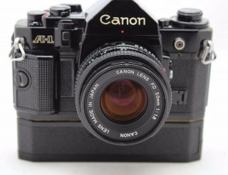 Canon A 1,  vintage 35mm SLR camera,  lens FD 50mm 1:1.  8 & Power Winder A 2