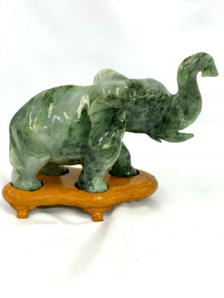 Chinese Hand Carved Jade Elephant Figurine On Wooded Stand.