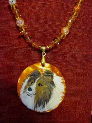 Shetland Sheepdog,  s & w,  hand - painted on round MOP pendant/bead/necklace 2