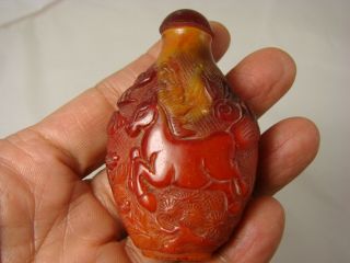 Chinese Amber Snuff Bottle With Carved Horse And Ox Motif