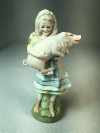 Vintage Porcelain Bisque Figurine Of A Young Girl Holding A Pig,  Charming